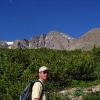 C ) Longs Peak Rises Behind the Trail